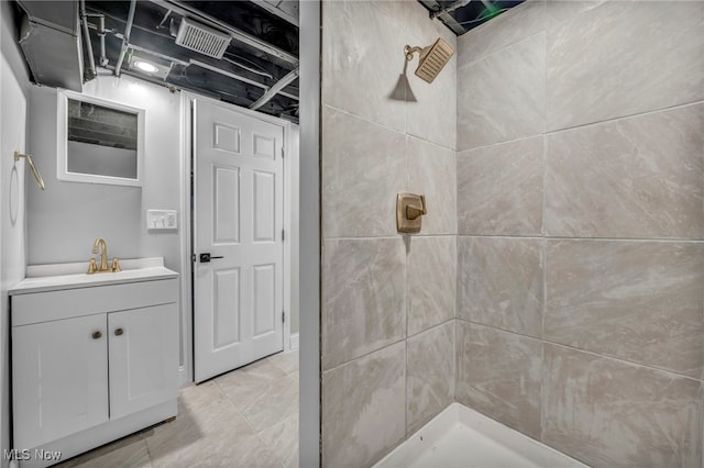 bathroom with a shower and vanity