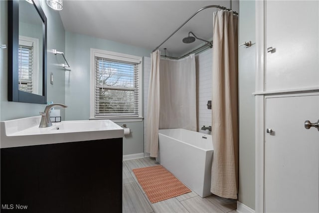 bathroom with vanity and shower / bath combo with shower curtain