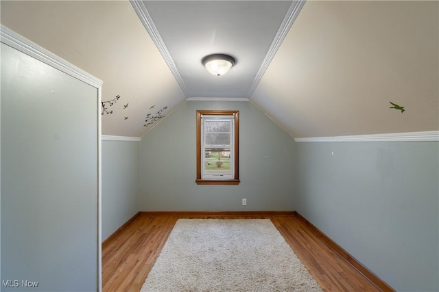 bonus room with light hardwood / wood-style flooring and lofted ceiling