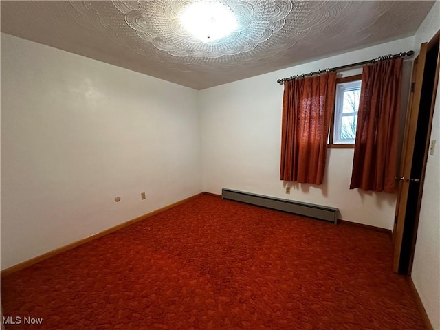 empty room featuring carpet floors, a textured ceiling, and a baseboard radiator