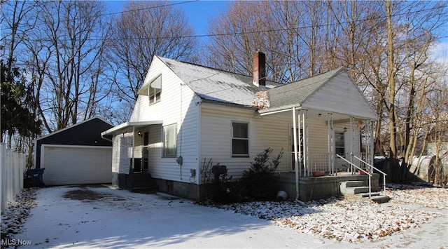 view of front of house featuring a garage and an outdoor structure