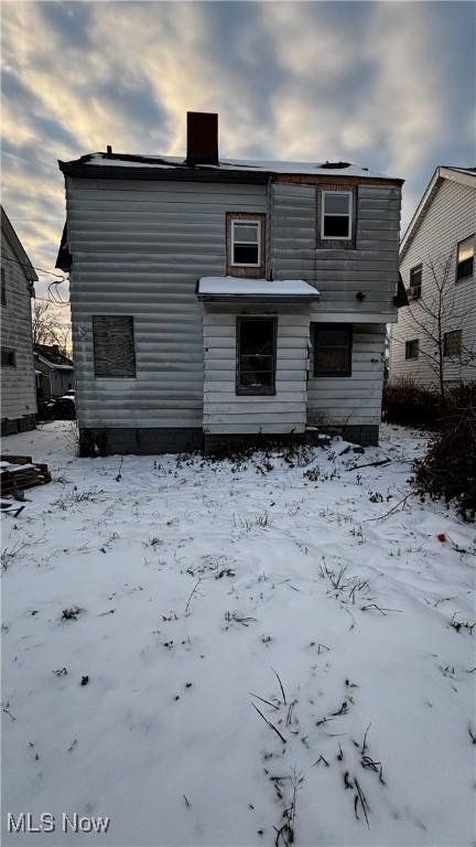 view of snow covered property