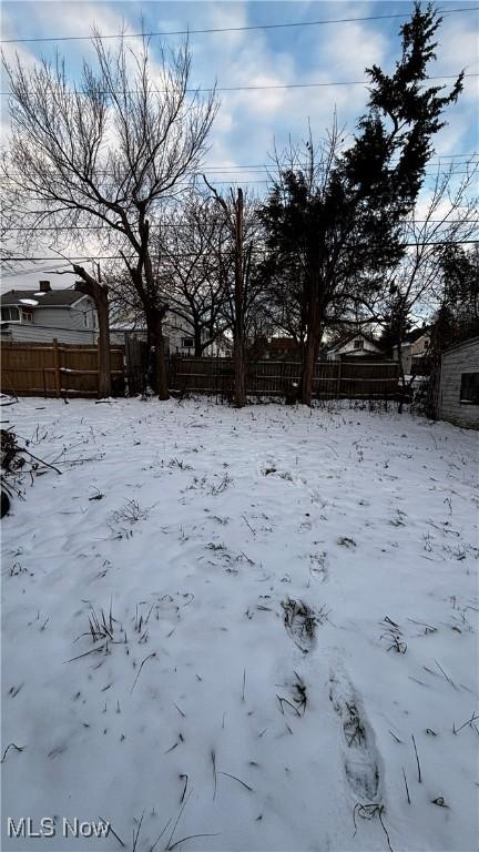 view of yard layered in snow