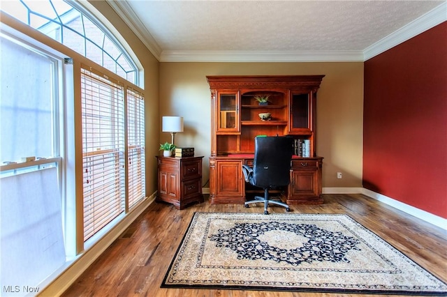 home office featuring a textured ceiling, crown molding, and dark wood-type flooring