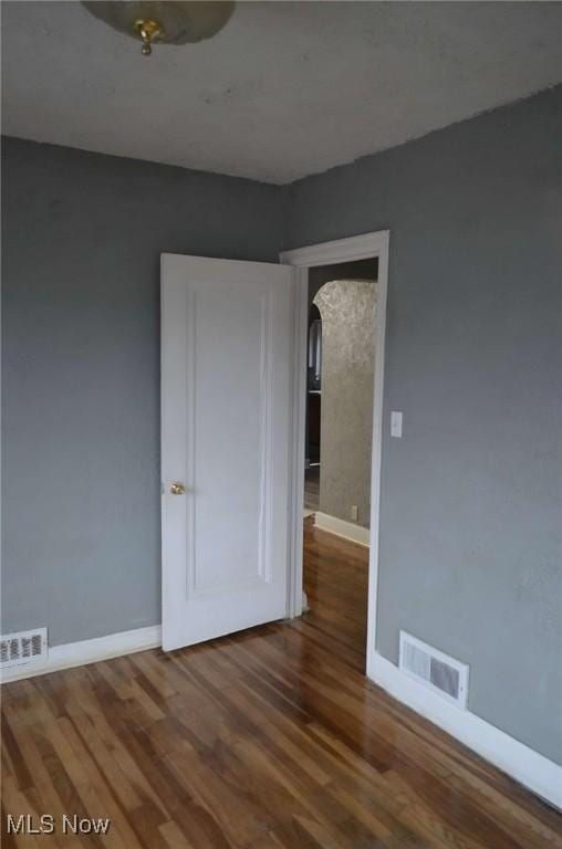 spare room featuring hardwood / wood-style flooring