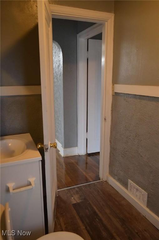 bathroom featuring vanity and hardwood / wood-style flooring