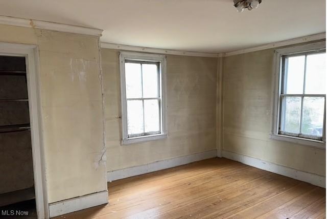 unfurnished room featuring light hardwood / wood-style floors