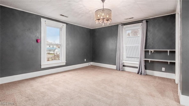 unfurnished bedroom with an inviting chandelier, light colored carpet, and multiple windows