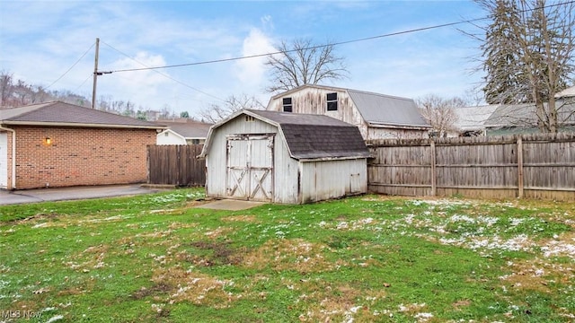 view of outbuilding with a yard