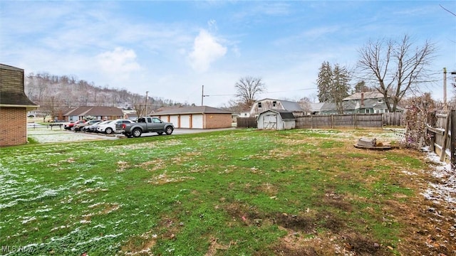 view of yard with a storage unit