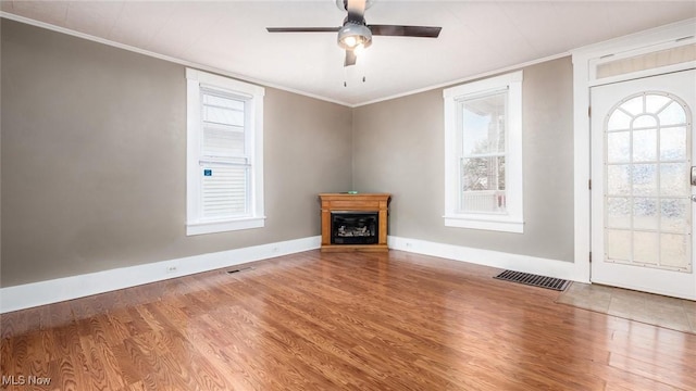 entryway featuring crown molding, ceiling fan, and hardwood / wood-style flooring