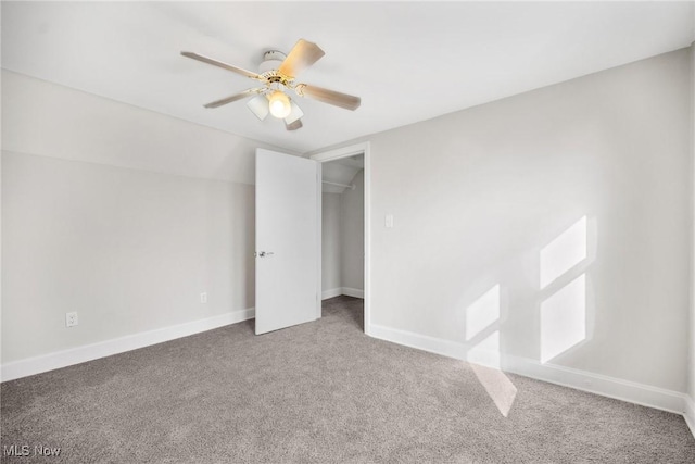 unfurnished bedroom featuring carpet flooring, ceiling fan, and a closet