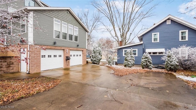 view of property exterior featuring a garage