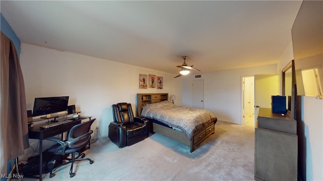 bedroom with ceiling fan and light colored carpet