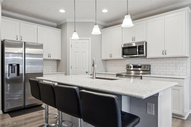 kitchen featuring white cabinetry and appliances with stainless steel finishes