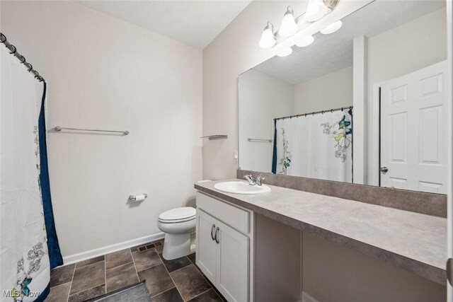 bathroom with toilet, visible vents, vanity, baseboards, and an inviting chandelier