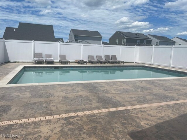 view of pool with fence, a fenced in pool, and a patio