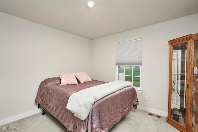 bedroom with light carpet