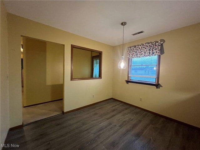 unfurnished dining area with dark hardwood / wood-style floors