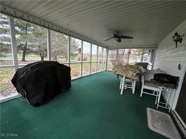 sunroom featuring a wealth of natural light and ceiling fan