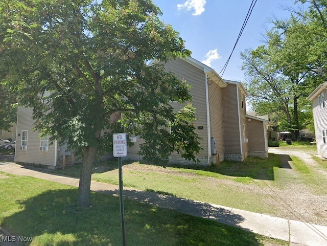 view of property exterior featuring a yard