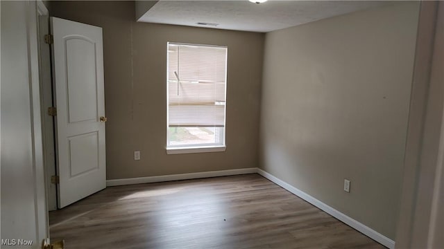 empty room with light wood-type flooring