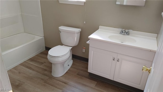 bathroom featuring hardwood / wood-style flooring, vanity, and toilet