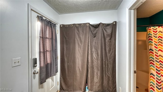 bathroom with a textured ceiling