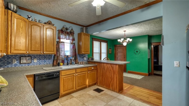 kitchen featuring ceiling fan with notable chandelier, a textured ceiling, sink, black dishwasher, and hanging light fixtures