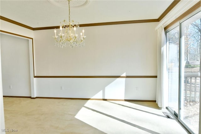 unfurnished room with carpet, an inviting chandelier, and ornamental molding