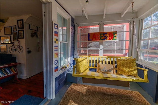 sunroom with beam ceiling