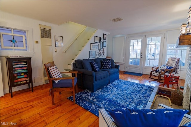 living room featuring hardwood / wood-style flooring and french doors