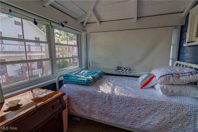 bedroom with beam ceiling