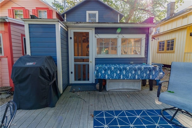 wooden terrace with area for grilling