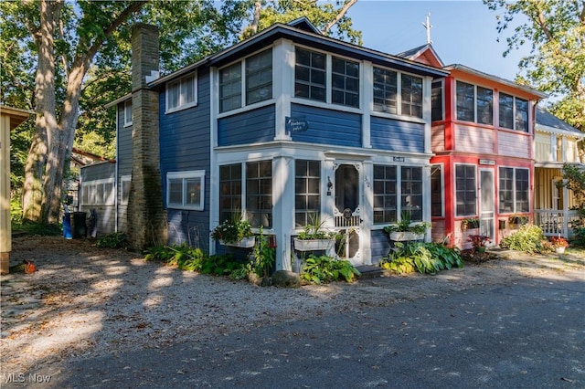 view of front facade featuring a sunroom