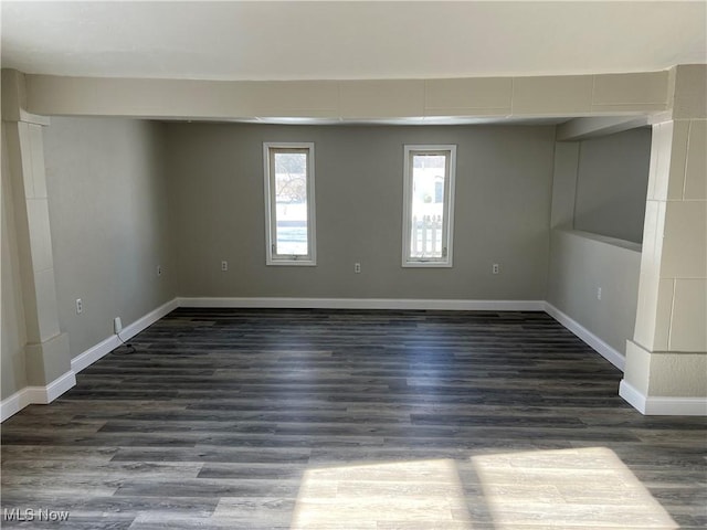 spare room with dark hardwood / wood-style flooring