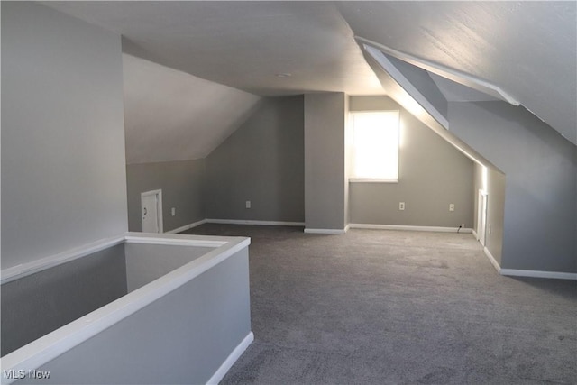 bonus room featuring carpet floors and lofted ceiling