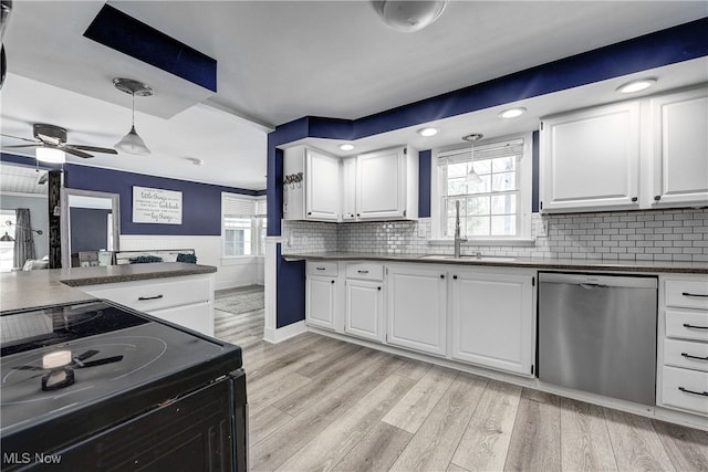 kitchen featuring white cabinets, dishwasher, light hardwood / wood-style floors, and sink