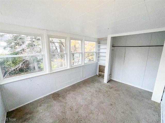 unfurnished sunroom featuring a healthy amount of sunlight