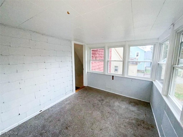 unfurnished sunroom with a wealth of natural light