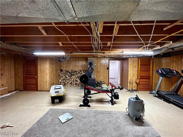 exercise area featuring wooden walls