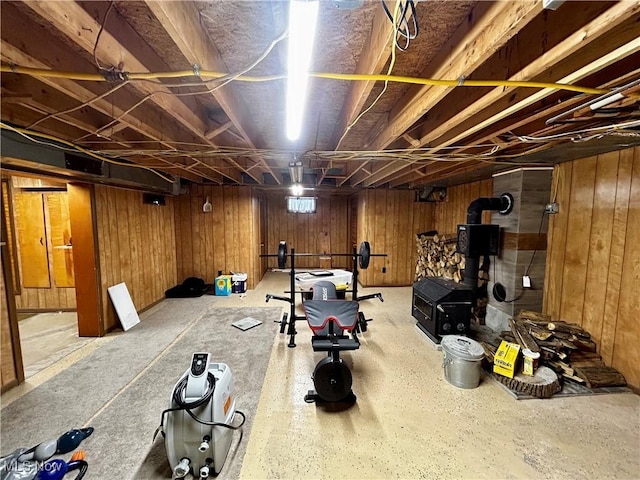 exercise room with wood walls