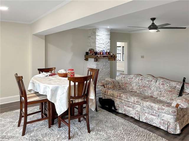 dining space featuring crown molding, ceiling fan, and hardwood / wood-style flooring