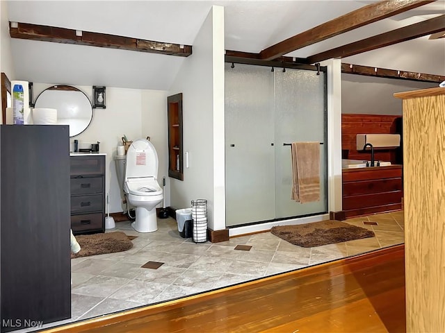 bathroom featuring vaulted ceiling with beams, wood-type flooring, a shower with shower door, and toilet