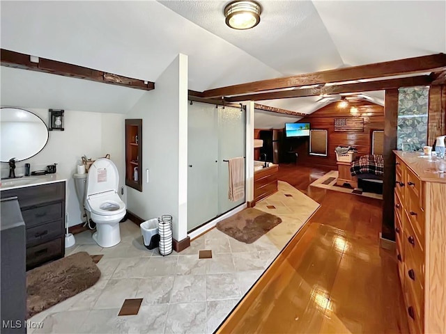 bathroom with vaulted ceiling with beams, wooden walls, vanity, and a shower with shower door