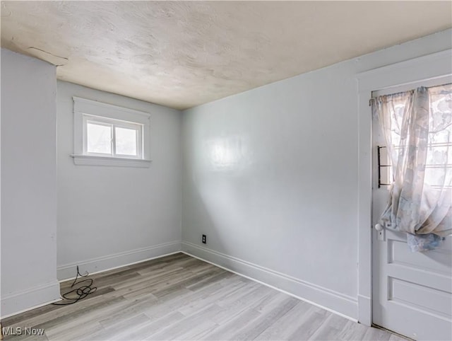 unfurnished room featuring light hardwood / wood-style flooring