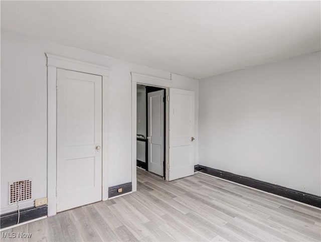 unfurnished bedroom featuring light hardwood / wood-style floors