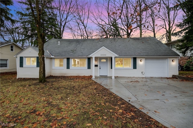 ranch-style home featuring a garage