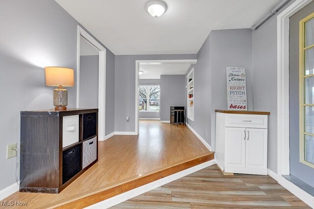 hall with light wood-type flooring