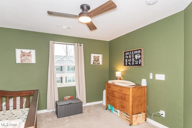 bedroom featuring ceiling fan and light colored carpet